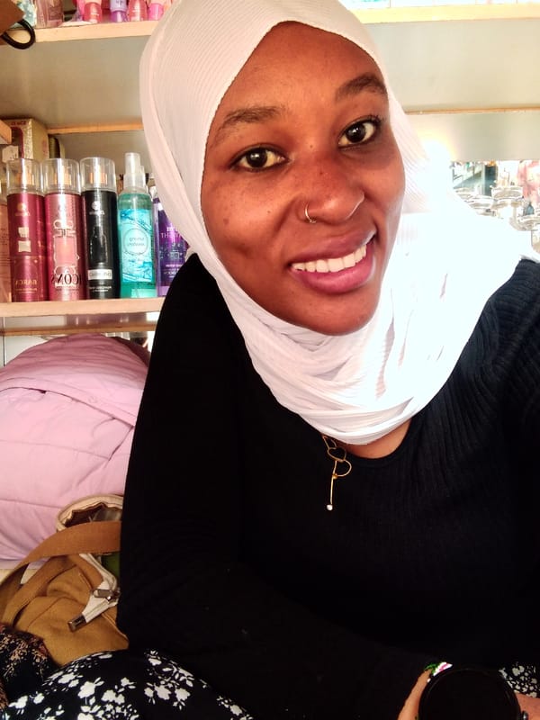 Young woman photographed in portrait session in Nyeri shop