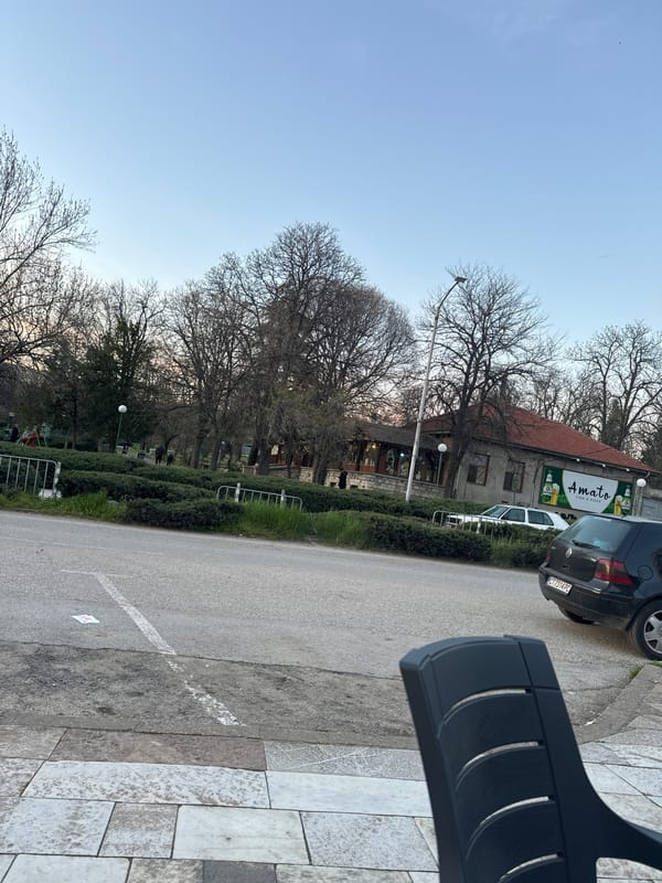 Street scene captured in Chirpan, Bulgaria featuring local restaurant