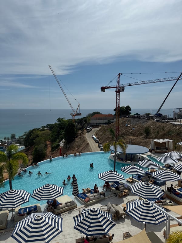 Beachside rooftop pool busy with swimmers in Karon Thailand