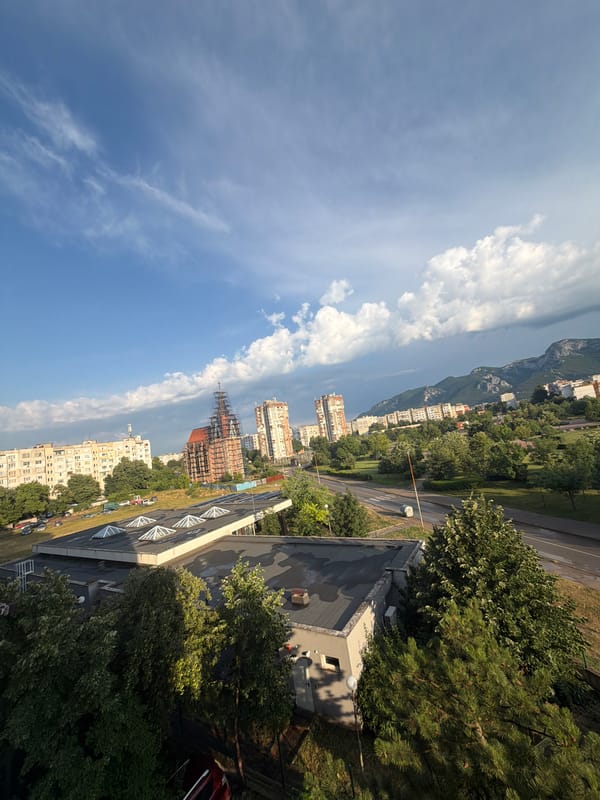 Vratsa from above, city and mountains under a shifting sky