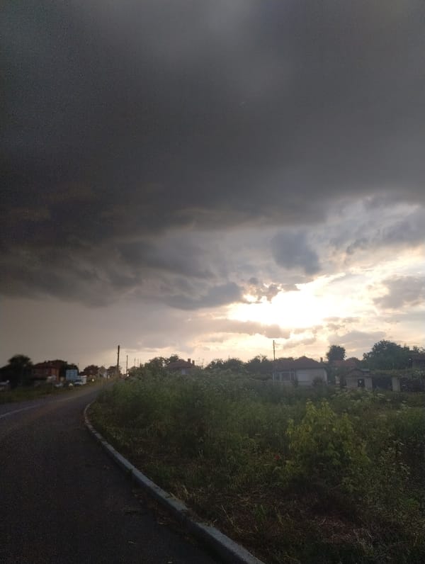 Rainbow appears over rural Bulgarian village after storm clouds
