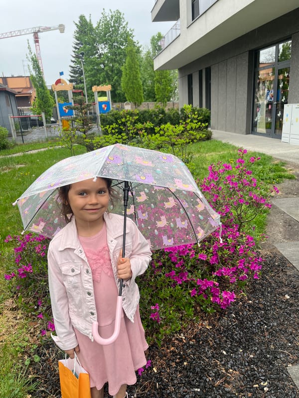 Spring day scenes: girl with umbrella, blooming flowers, residential streets