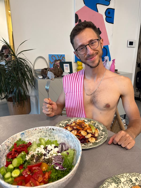Man enjoys multi-course salad meal at gray table
