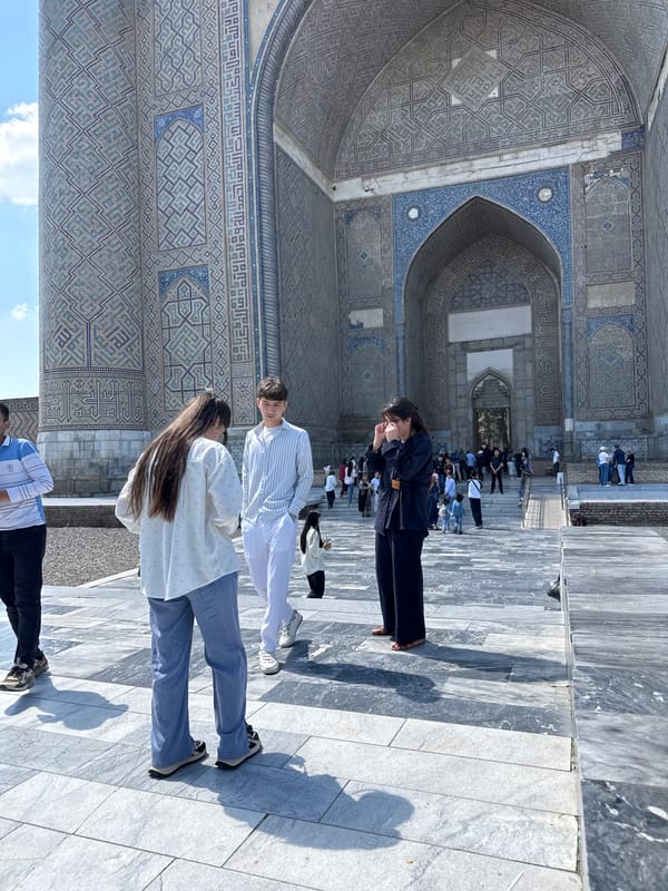 Morning tourism moments captured at Samarkand's historic Gur-e-Amir Mausoleum