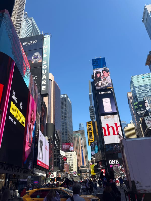 Times Square billboards and skyscrapers captured in upward view