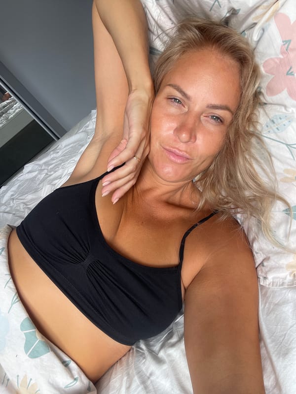 Relaxed morning moment on a sunlit bed in Baranovka