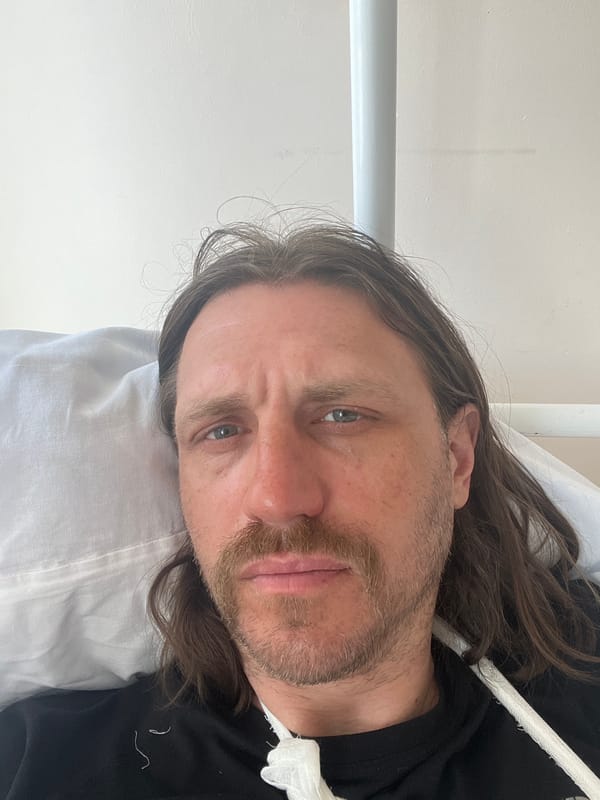 Man rests in medical facility during early morning hours