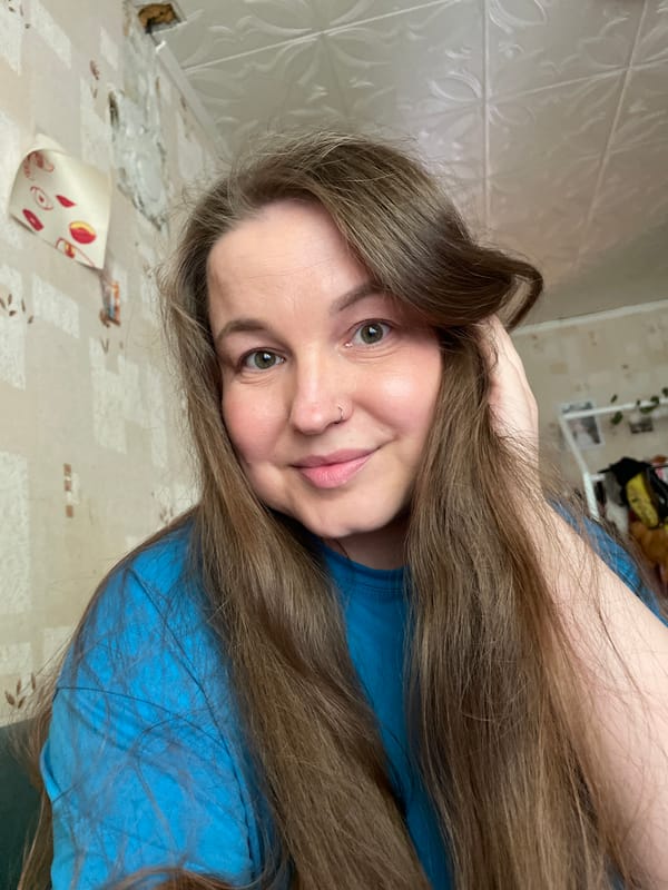 Woman documents afternoon walk through blooming Izhevsk streets
