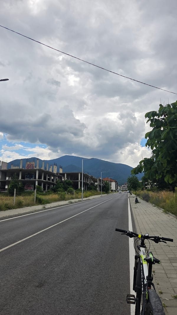Cloudy day on a Bansko street, bicycle parked nearby