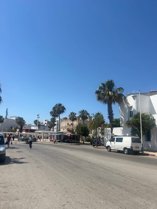 Tourist documents historic sites and infrastructure in Martil, Morocco