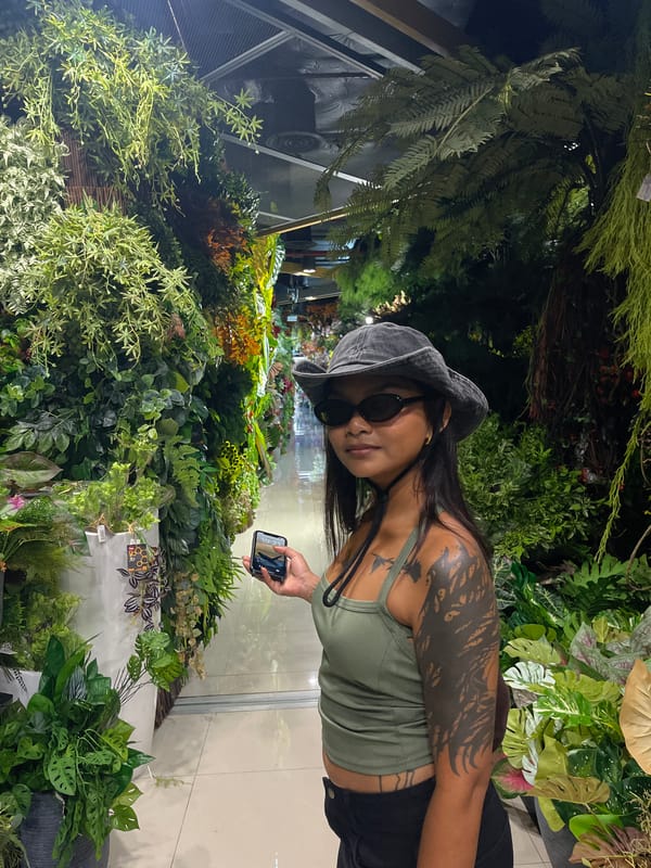 Browsing Bangkok's artificial flower market and a curiosity stall nearby