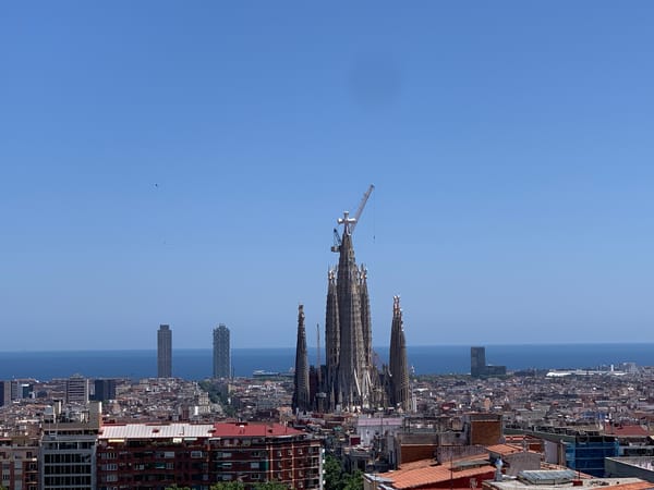 Tourist documents Barcelona landmarks, cannabis plants, pastries during afternoon walkabout