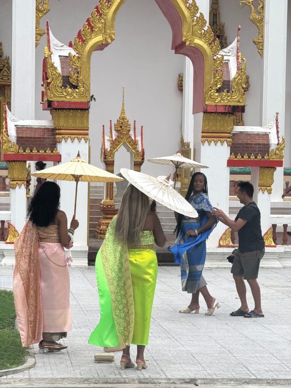 Green snake spotted outside Chalong temple during morning visit