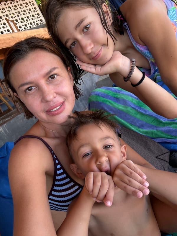 Family enjoys early morning beach time in Kuta Selatan