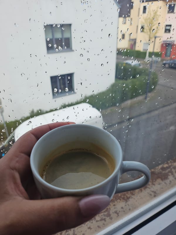 Coffee and rain watching moment captured in Trier