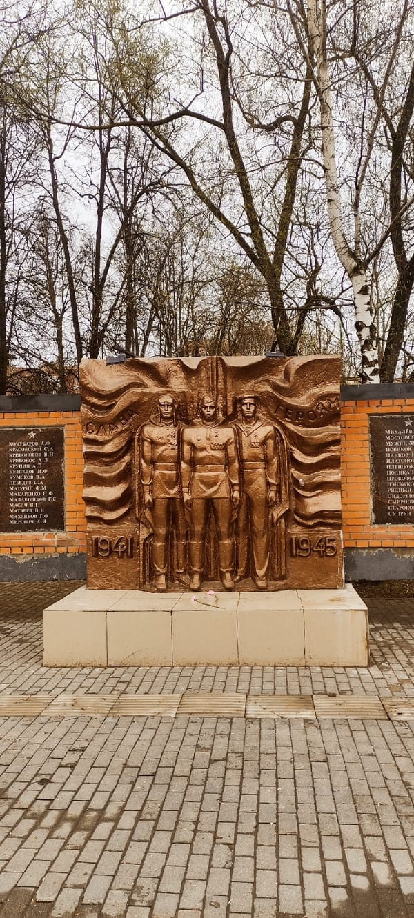 Visitor documents war memorial, space mural, wind turbine in Shchyolkovo