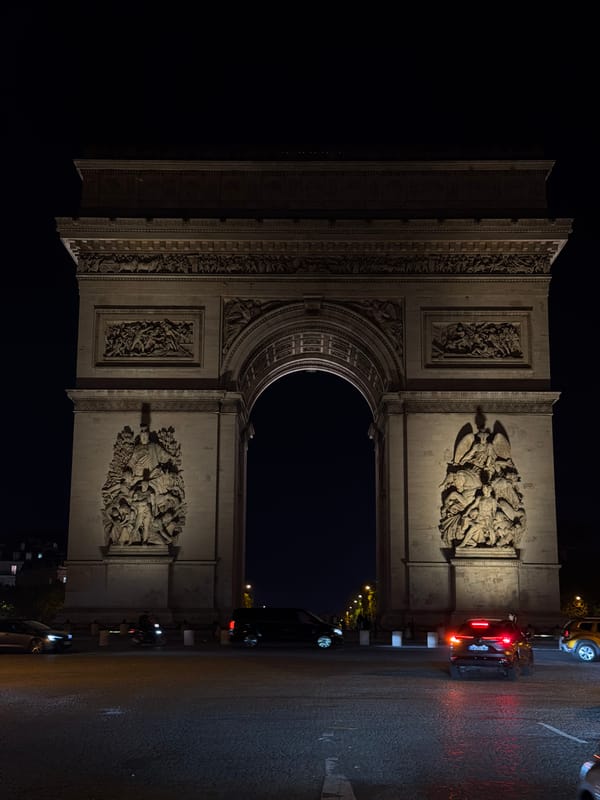 Arc de Triomphe seen illuminated at night in Paris