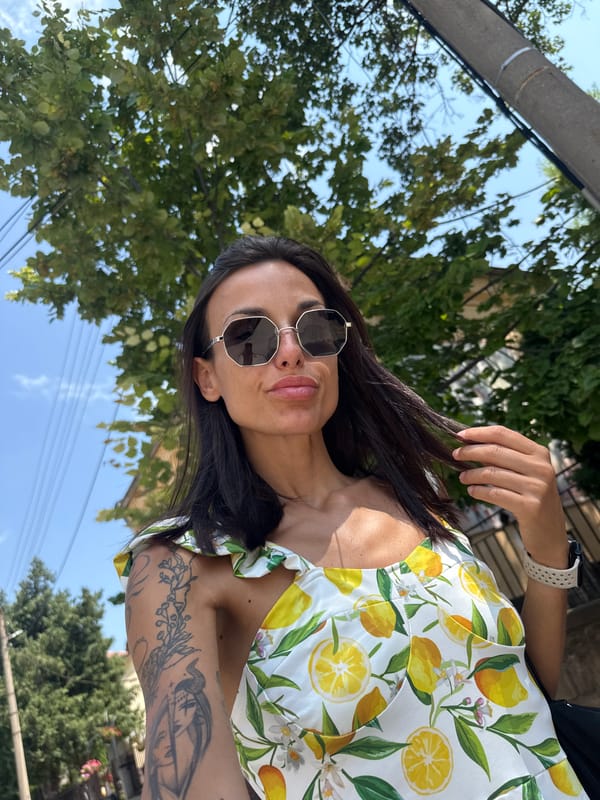 Selfie session on a Pleven street, yellow building backdrop