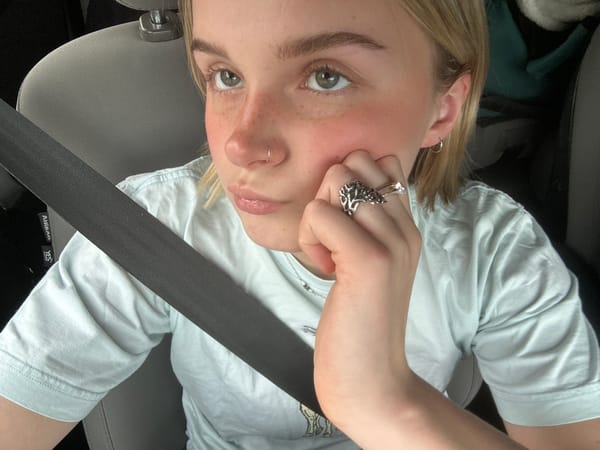 Woman photographed in car from upside-down angle in North Vancouver