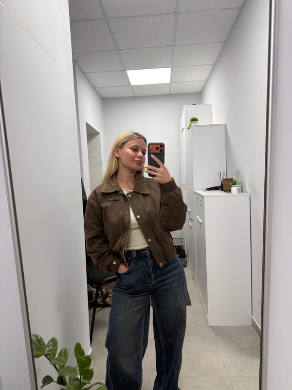 Woman takes mirror selfies in Sarapul interior space