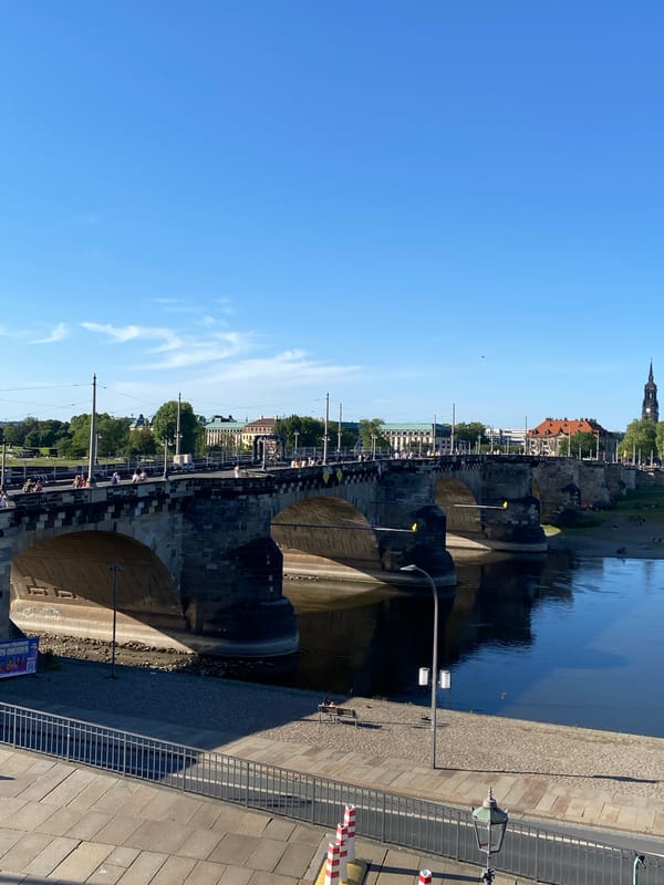 Tourist documents Dresden landmarks during afternoon walking tour