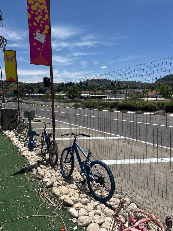 Bicycles lined along fence in Maalot-Tarshiha, Israel