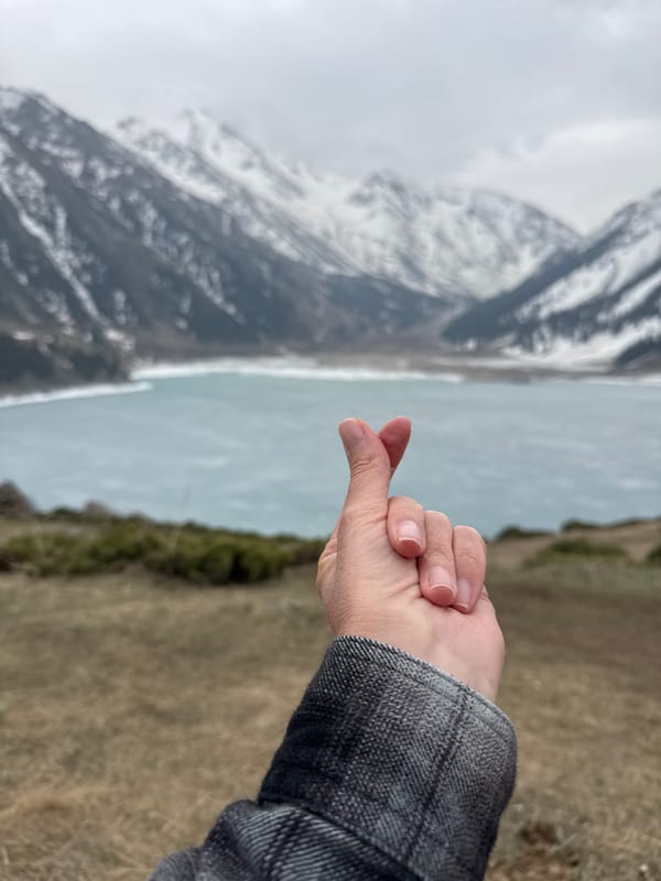 Tourist captures scenic mountain views in Almaty, Kazakhstan