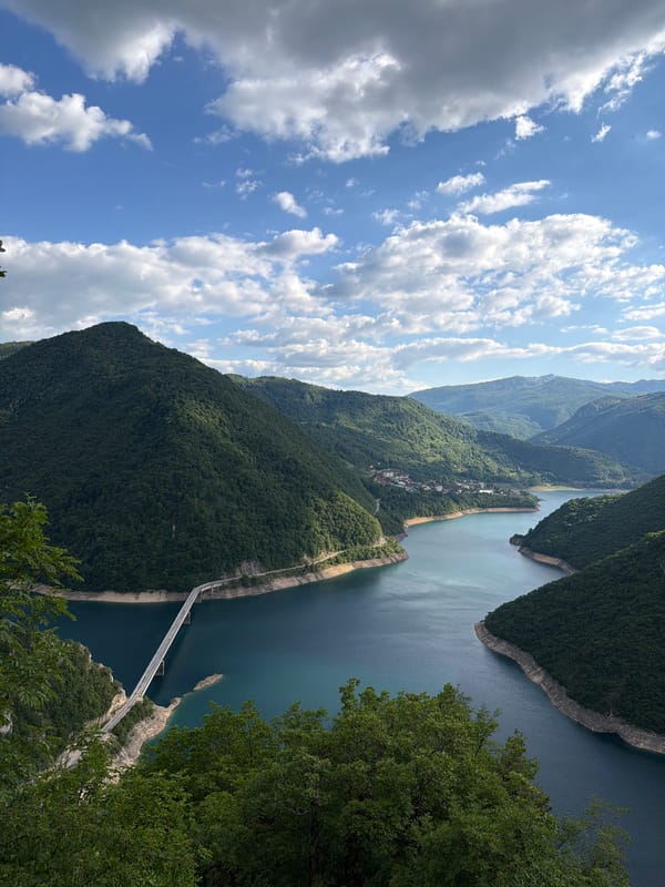 Aerial view captures Piva Lake Bridge spanning waters near Plužine