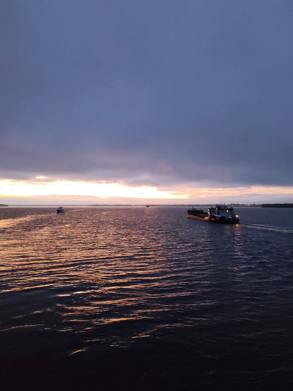Barge crossing the Sheksna River at twilight
