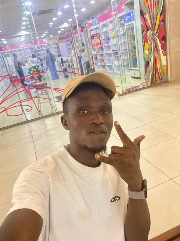 Young man photographs himself in Ikeja shopping area