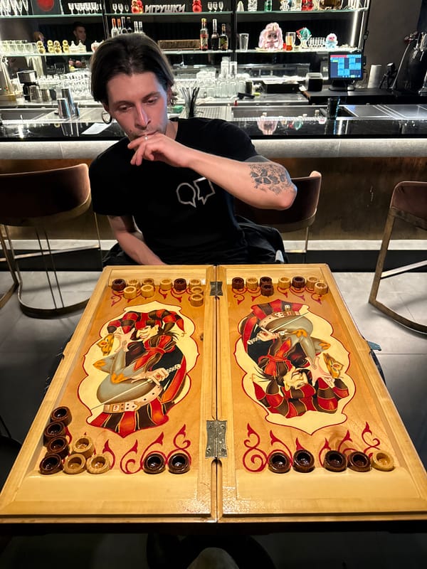 Man plays backgammon at Sochi bar
