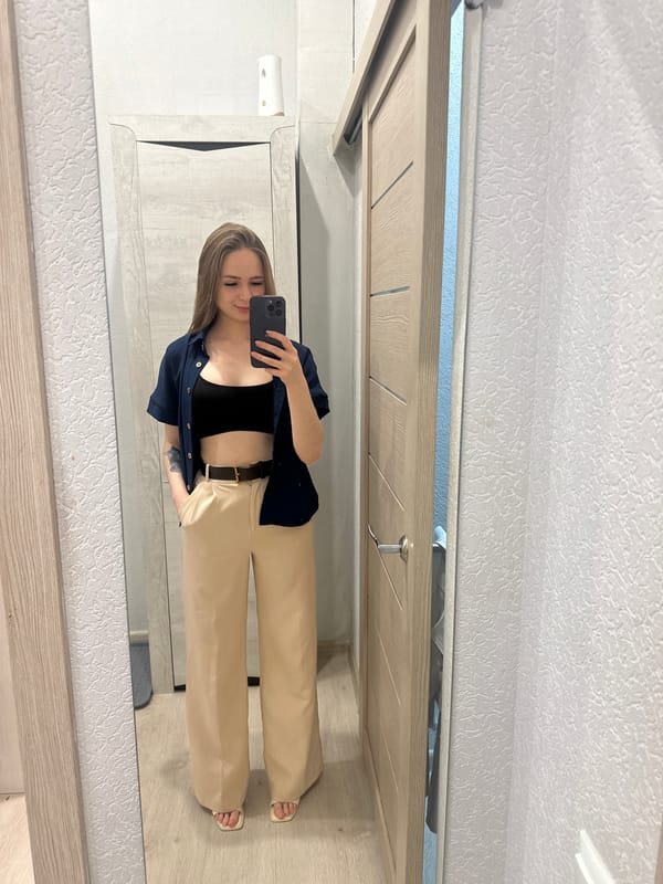 Woman Takes Multiple Mirror Selfies in Bathroom