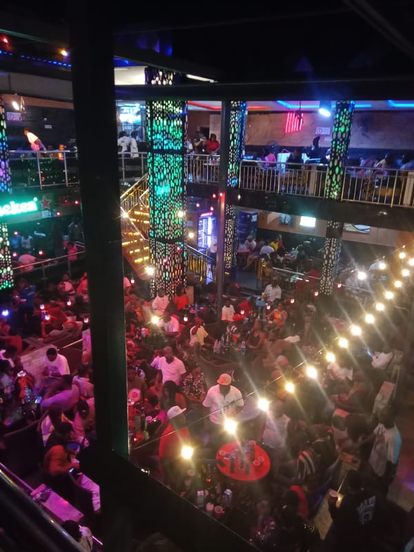 Entertainer performs at crowded multi-level bar in Obosi, Nigeria
