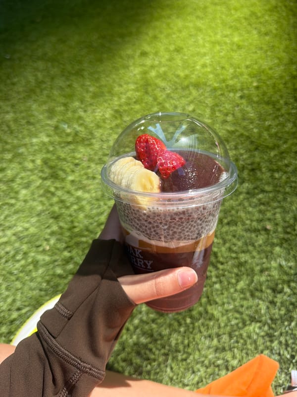 Toronto resident enjoys acai bowl near CN Tower downtown