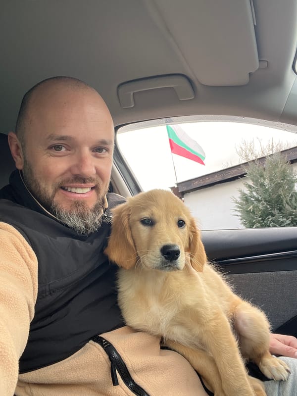 Man takes selfie with puppy near garage in Bulgaria