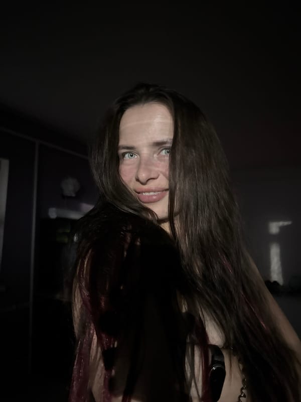 Indoor portrait session lit by a green star projector in Rusalevka