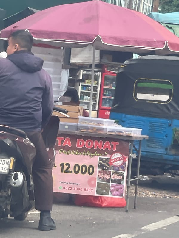 Street life snapshots across Jakarta: bikes, vans, and street food
