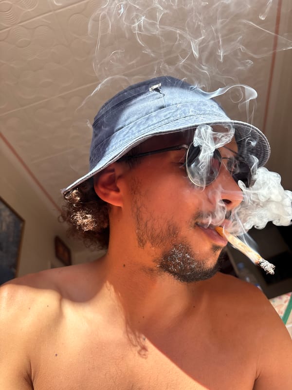Man photographed smoking on Tangier terrace June afternoon