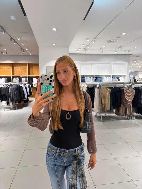 Young woman documents shopping trip across Alicante retail centers