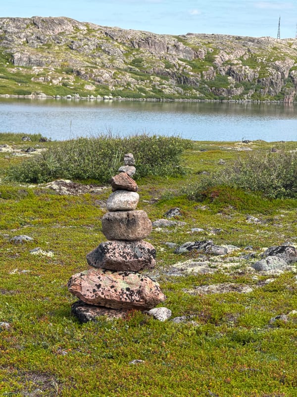 Exploring Teriberka's rocky boardwalk trail on a summer afternoon