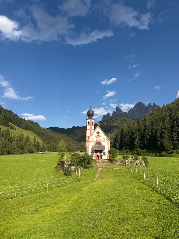 St. Magdalena Church framed against the Dolomites, Val di Funes