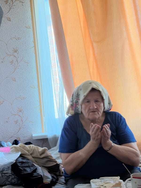 Quiet afternoon indoors in Tambov — person and pet at rest
