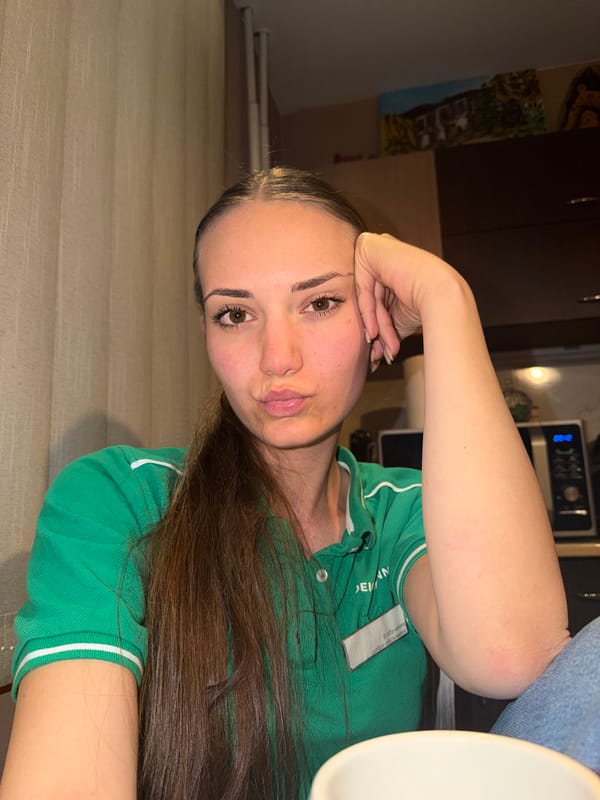 Woman takes selfies indoors in Buhovo, Bulgaria