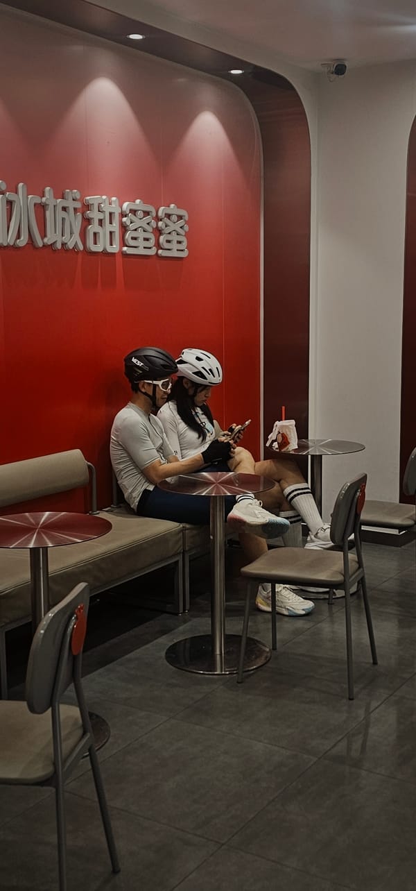 Two diners seated separately at Jiulongpo District cafe