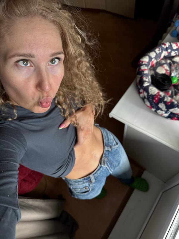 Woman photographs herself in early morning Perm selfie session