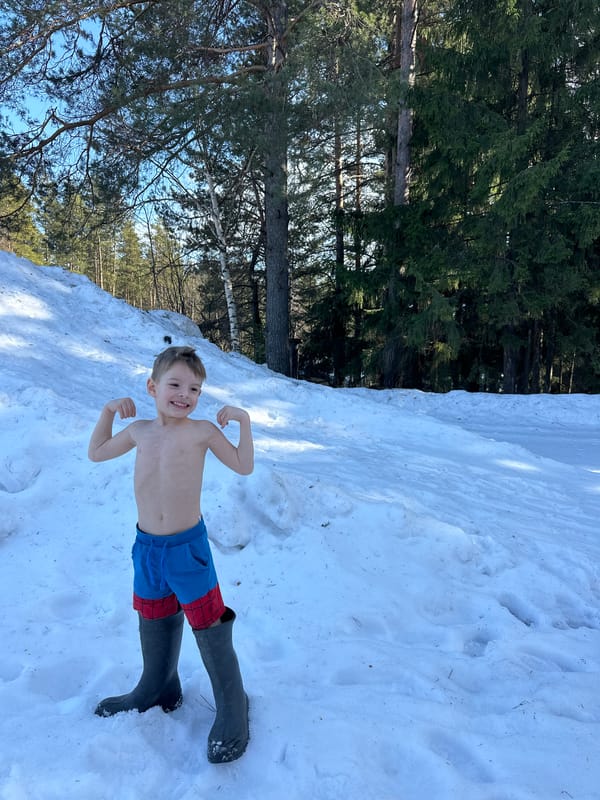Family enjoys sunny winter day outdoors in Прикамский Russia