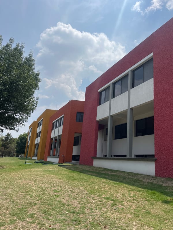 Gradient-painted buildings photographed in San Andrés Cholula, Mexico