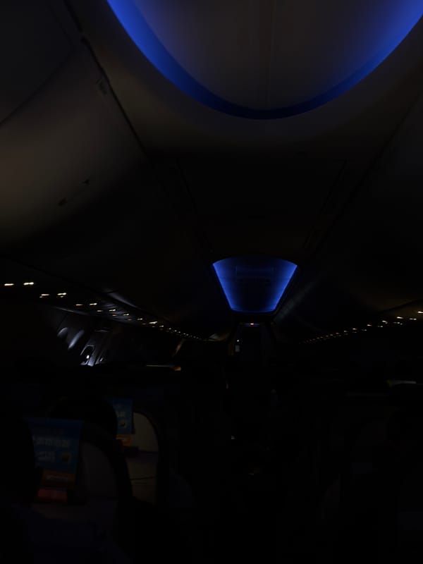 Aircraft cabin interior observed during night flight over Thailand