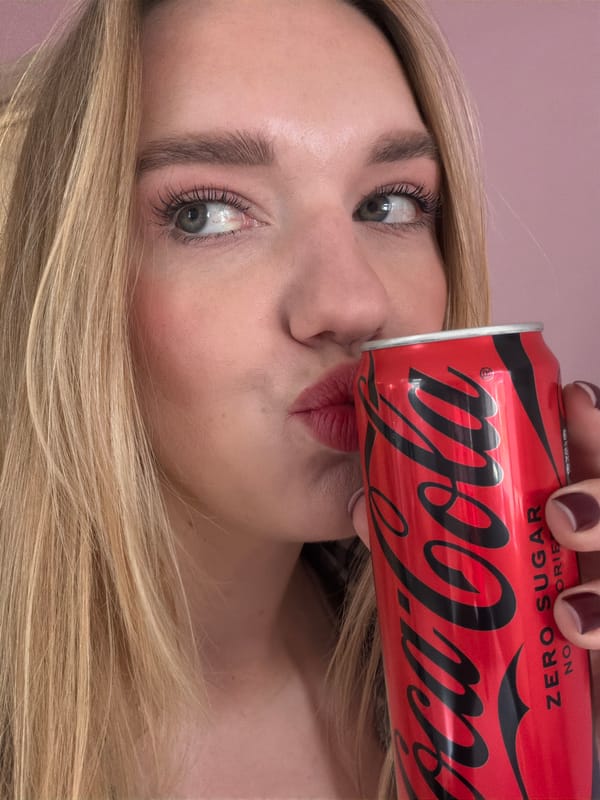 Woman enjoys Coke and marshmallow treats in Latvian home