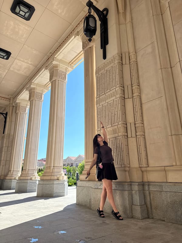 Woman spends afternoon sightseeing at ornate classical building complex